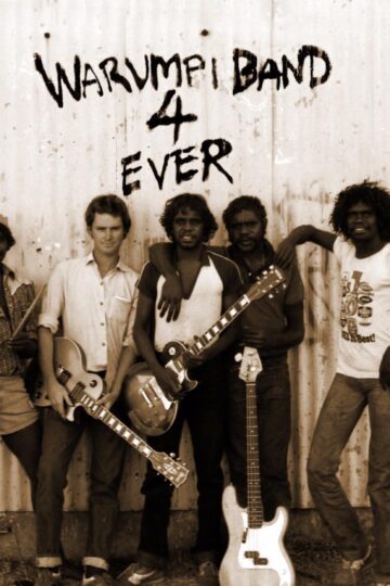 The Warumpi Band was formed in 1980 in Papunya and was one of the earliest bands recorded by CAAMA.

Warumpi Band are an Australian country and Aboriginal rock group which formed in the outback settlement of Papunya, Northern Territory in 1980. The original line-up was George Burarrwanga on vocals and didgeridoo, Gordon Butcher on drums, his brother Sammy Butcher on guitar and bass guitar, and Neil Murray on rhythm guitar and backing vocals. Their key singles are ‘Jailanguru Pakarnu’ (1983), ‘Blackfella/Whitefella’ (1985), ‘Sit Down Money’ (1986), ‘My Island Home’ (1987) and ‘No Fear’ (1987). The group released three albums, Big Name, No Blankets (1985), Go Bush! (1987) and Too Much Humbug (1996). From late 1987 to mid-1995 the group rarely performed as Murray focused on his solo career. In early 1995, Christine Anu (former backing singer in Murray’s touring group, The Rainmakers), issued a cover version of ‘My Island Home’. Warumpi Band regrouped before disbanding in 2000. Burarrwanga died on 10 June 2007 of lung cancer.

The Warumpi Band were formed in 1980 in Papunya – an outback settlement about 240 kilometres (150 mi) north-west of Alice Springs in the Northern Territory – as a country and Aboriginal rock group.Neil Murray was a Victorian-born schoolteacher and labourer who was working in the region. He met local brothers Gordon Butcher Tjapanangka and Sammy Butcher Tjapanangka of the Luritja people; and were joined by Sammy’s brother-in-law George Rrurrambu Burarrwanga (aka George Djilangya), visiting from Elcho Islands Yolngu people. Murray provided rhythm guitar and backing vocals, Gordon was on drums, Sammy on guitar and bass guitar, and Burarrwanga on vocals and didgeridoo. ‘Warumpi’ derives from the Luritja word for a ‘honey-ant dreaming site’, which lies near Papunya. Over the years, many different people played in the band at various times. The only consistent elements were Murray and Burarrwanga, with Sammy Butcher generally being available when band commitments did not take him too far from home for long.